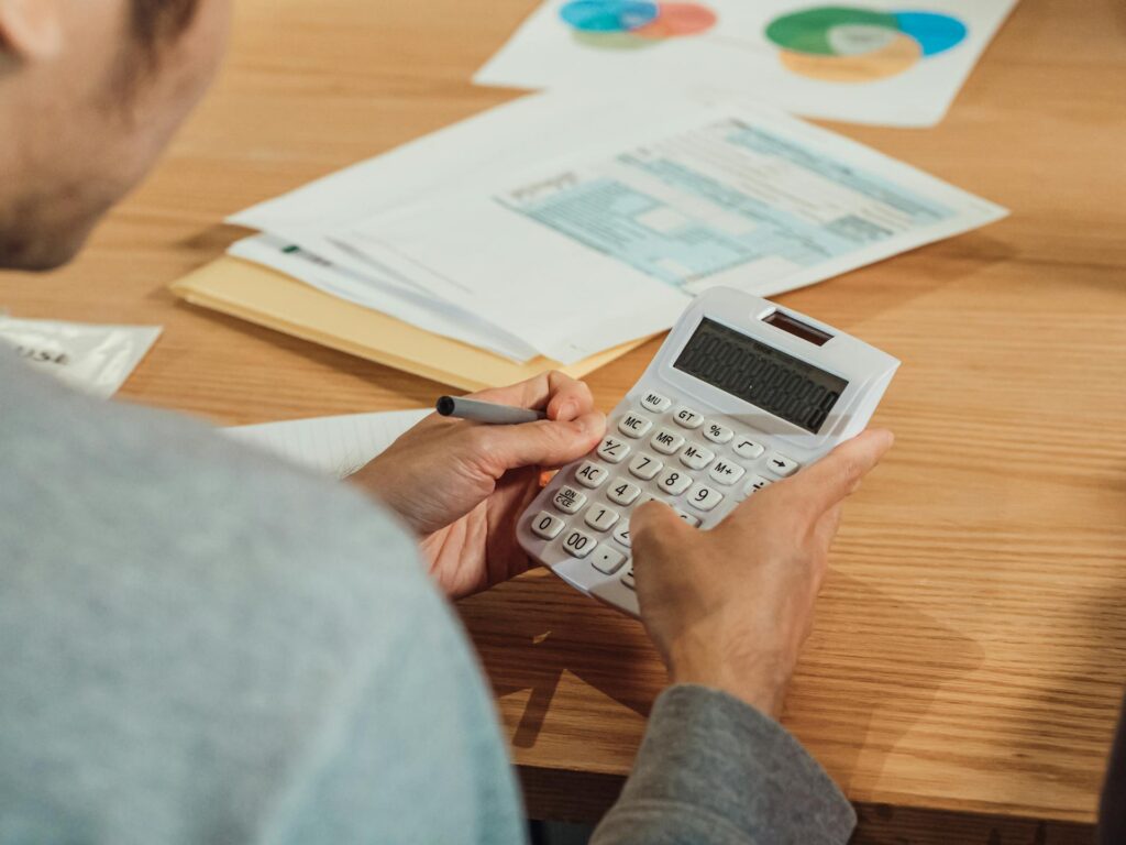A person using his calculator