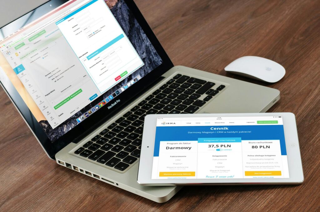 A tablet and a laptop showing a software