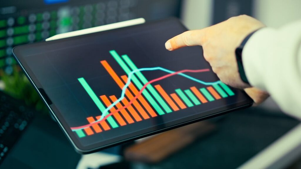A tablet showing bar graphs depicting an increase