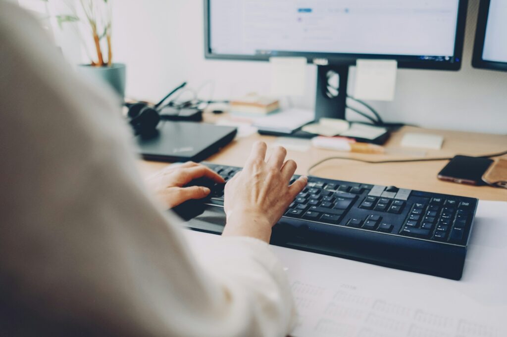 Close up of a person typing in keyboard