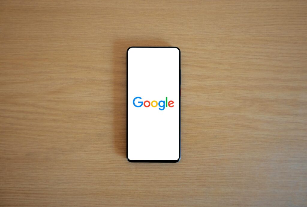 A wide shot of a phone with Google in the screen