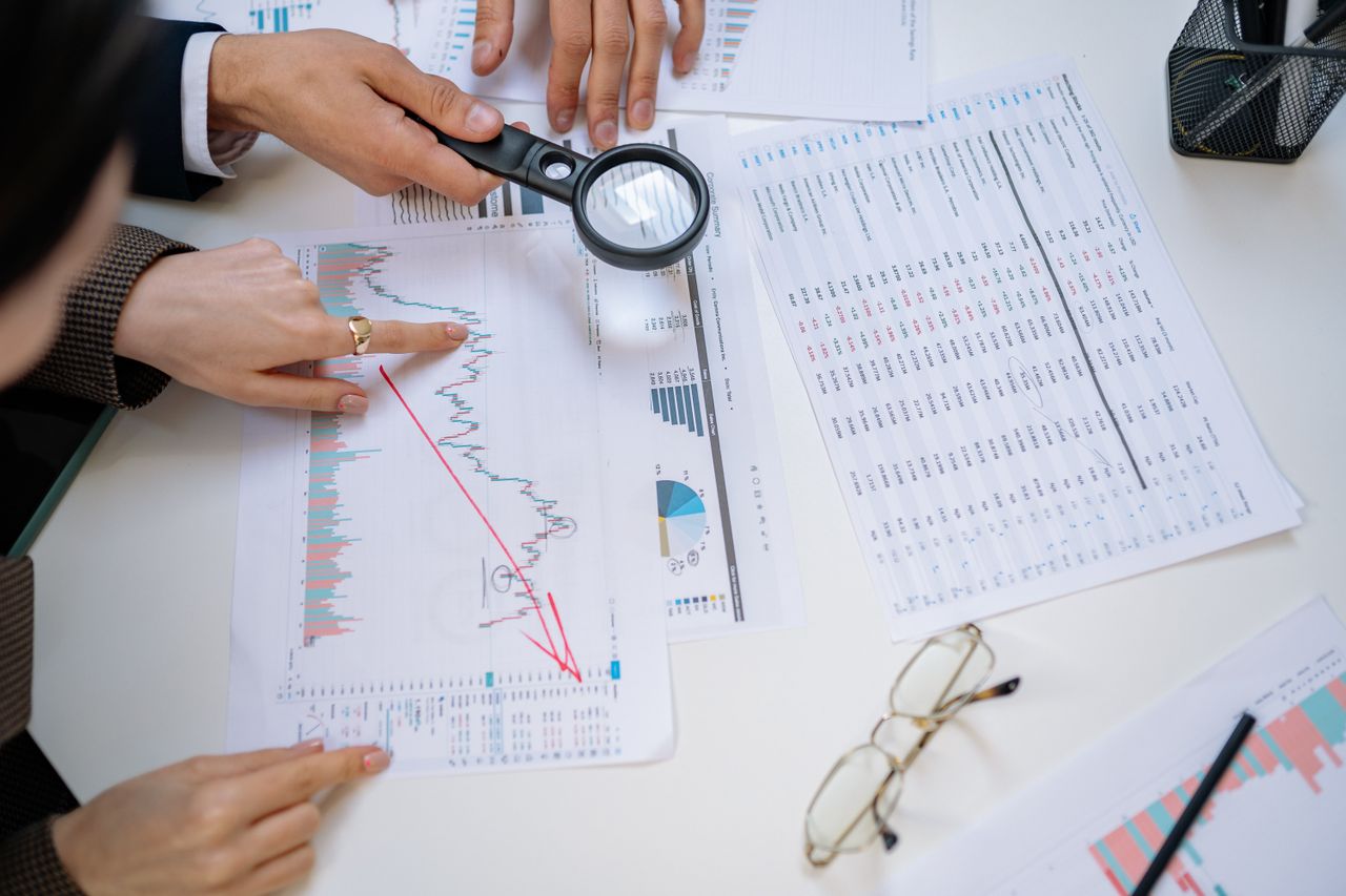 Business professionals examining financial documents