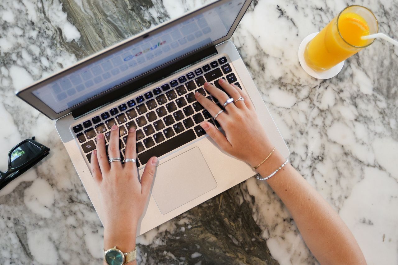 Over head shot of a person using a laptop